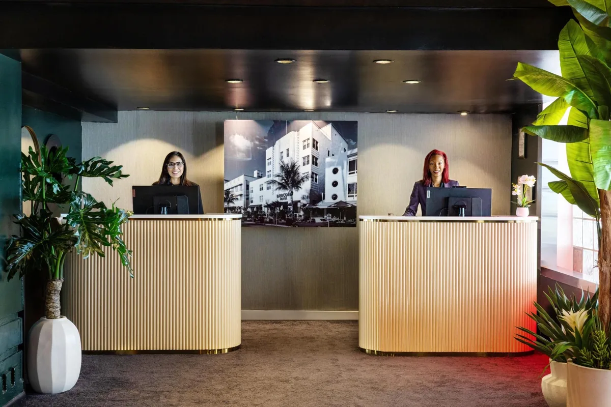 Fluted cream reception desks in the renovated lobby